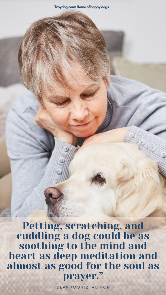 senior woman looking down and petting her dog